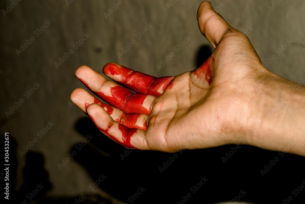 a badly bleeding hand and dark background Stock Photo | Adobe Stock