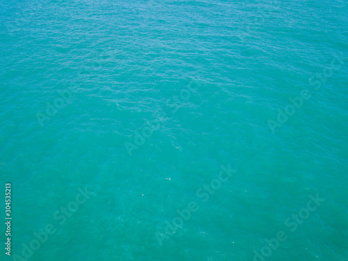 Aerial view of turquoise waves, water surface texture. Thailand