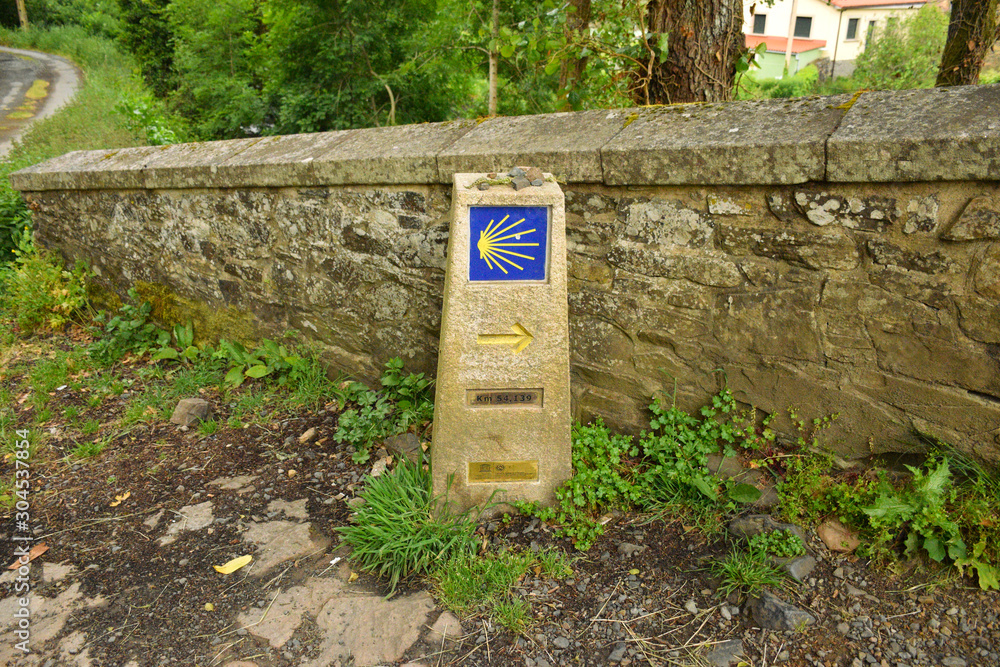 Scallop shell trail marker on the Camino de Santiago, the Compostela pilgrimage thru-hike, Galicia, Northern Spain (Spring) Scallop shell trail marker on the Camino de Santiago, the Compostela pilgrimage thru-hike, Galicia, Northern Spain (Spring)