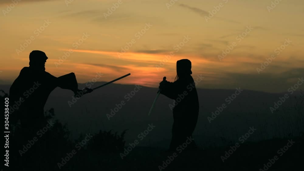 Two fantasy knights with swords on battlefield Two fantasy knights with swords on battlefield
