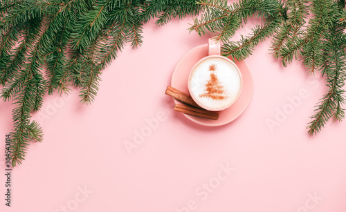 Top view of cup of latte with art in shape of Christmas tree