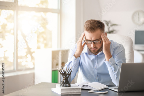 Young man suffering from he...