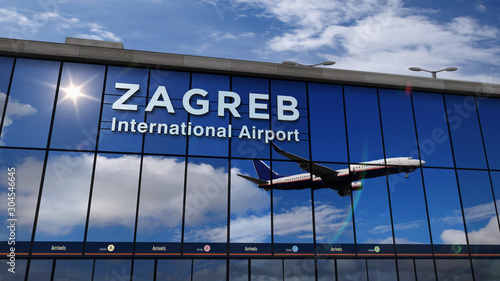 Airplane landing at Zagreb mirrored in terminal