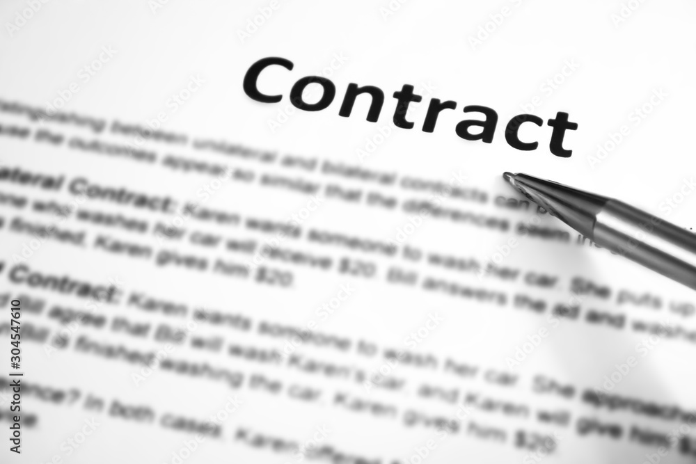 Close-up of silver pen on contract. Close-up of silver pen on contract.