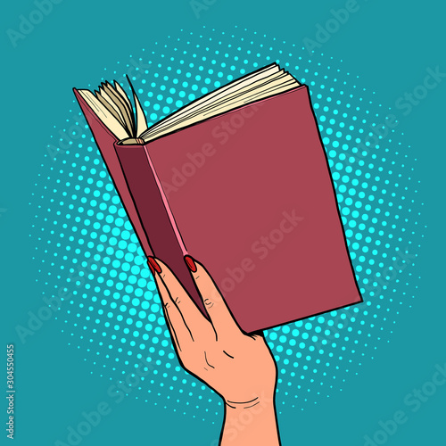 book in a female hand. reading and literature