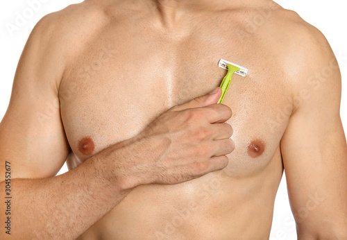 Handsome young man shaving torso on white background, closeup