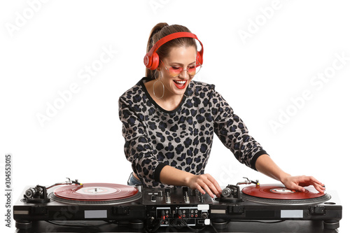 Female dj playing music on ...