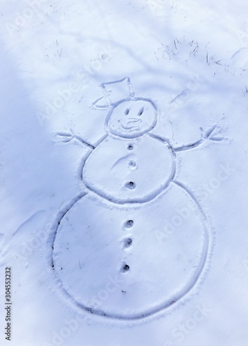 Drawing on the snow on the theme of the new year and Christmas 