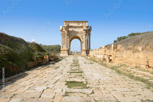 Leptis Magna, Libya. Roman Cobbled road leading to the Arch of Septimius Severus. photo