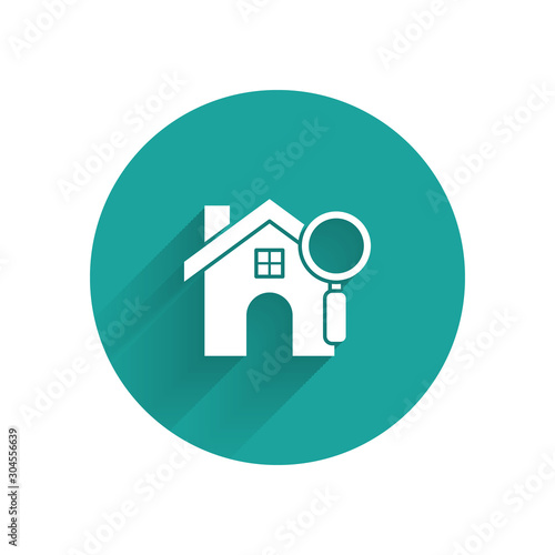White Search house icon isolated with long shadow. Real estate symbol of a house under magnifying glass. Green circle button. Vector Illustration