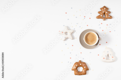 Christmas sweet composition. Xmas gingerbread cookies and coffee on white background. Christmas  New Year  winter concept. Flat lay  top view  copy space