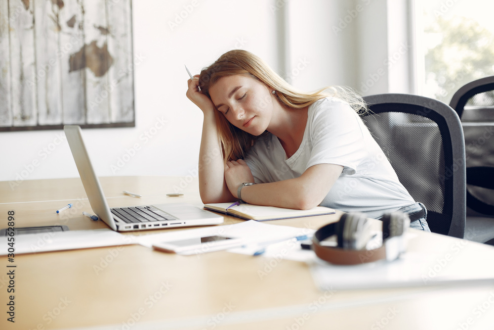 Students sleeping at the table. Girl learning and use the laptop Students sleeping at the table. Girl learning and use the laptop