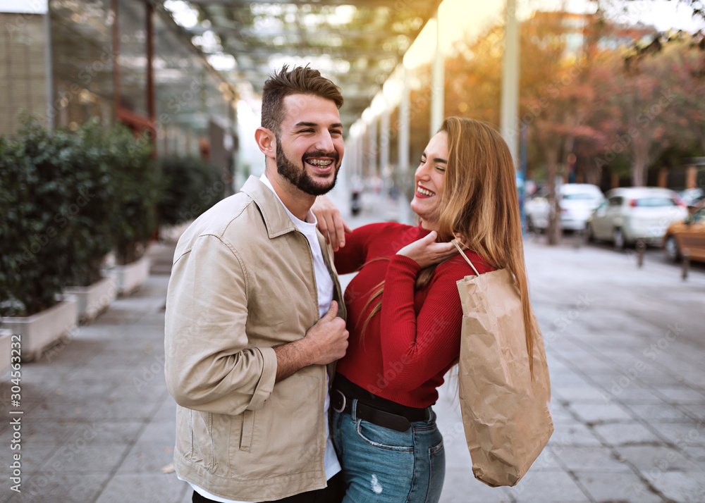 happy man and woman shopping. lifestyle concept
