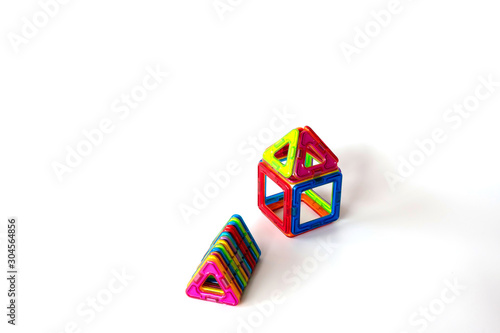Magnetic toys on white background.