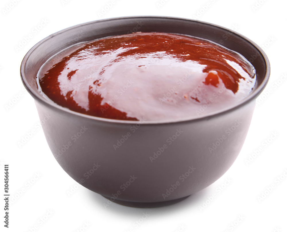 Bowl with tasty barbecue sauce on white background Bowl with tasty barbecue sauce on white background