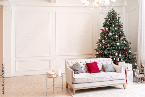 Interior of room with beautiful decorated Christmas tree