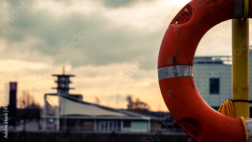 life preserver on yellow pole