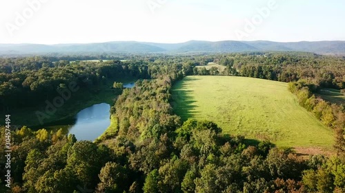 An aerial view of a drone flying over a valley in the Ouachita mountains