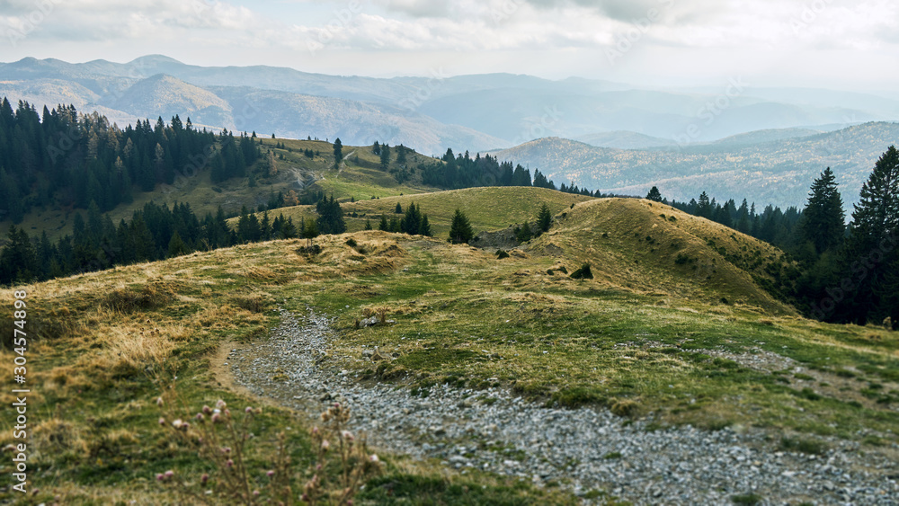 Naklejka premium Dust road and hills
