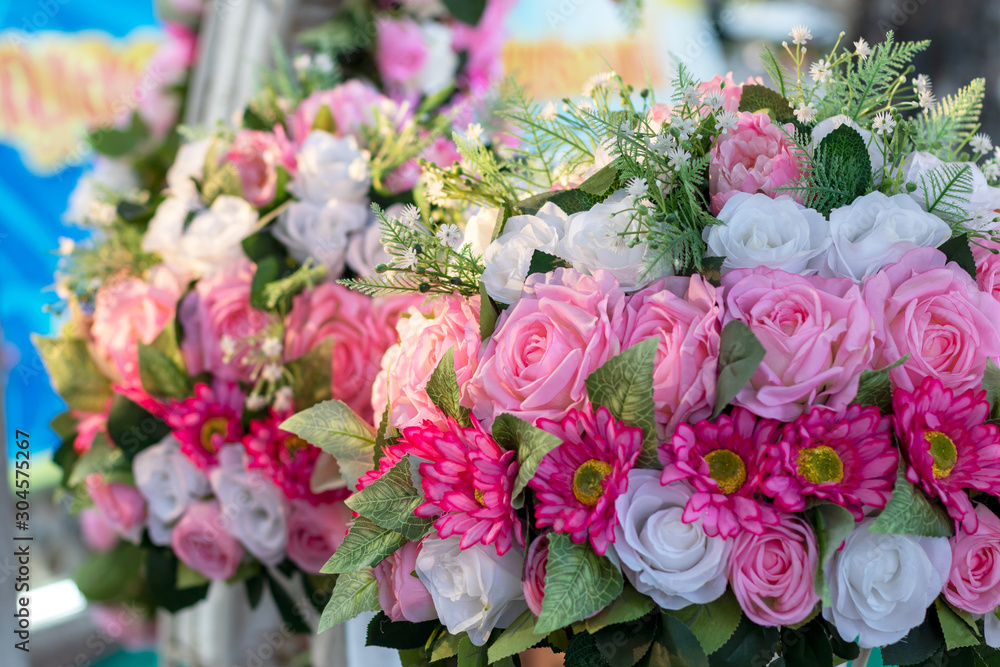 Beautiful artificial pink and white rose bouquet.