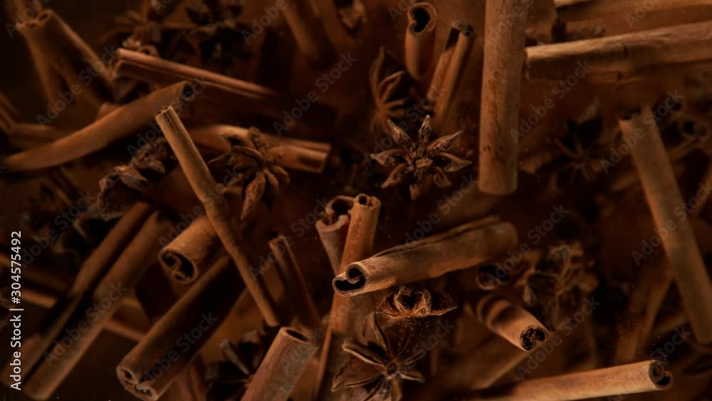 Super slow motion of flying whole cinnamon barks and star anise spice. Super slow motion of flying whole cinnamon barks and star anise spice.