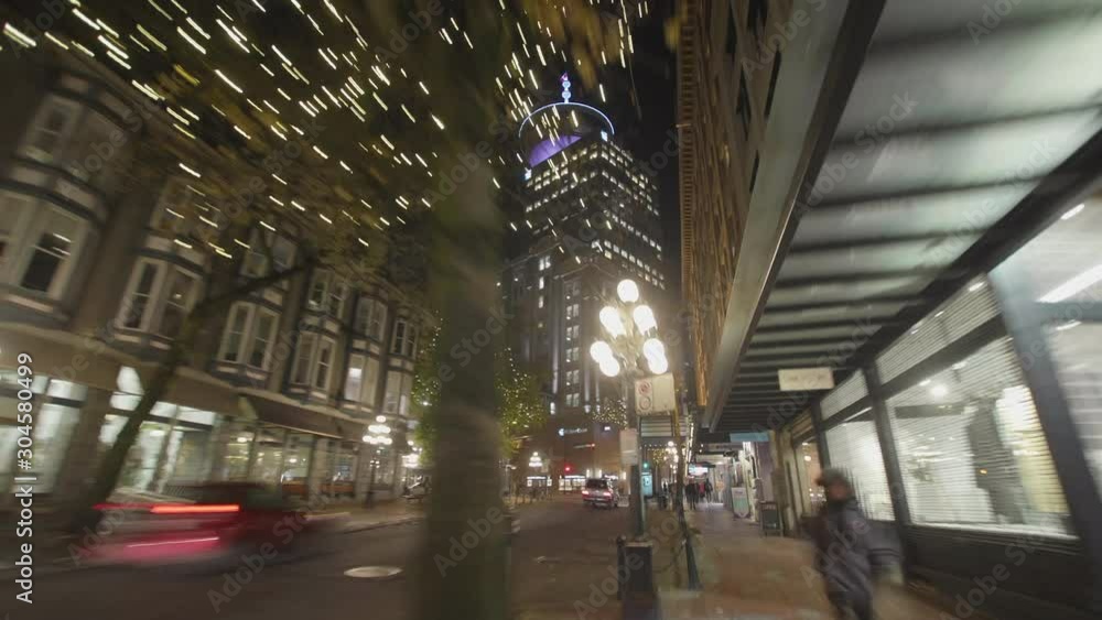 Hyperlapse of Cobblestone Street at Night with Modern Tower in Background Hyperlapse of Cobblestone Street at Night with Modern Tower in Background
