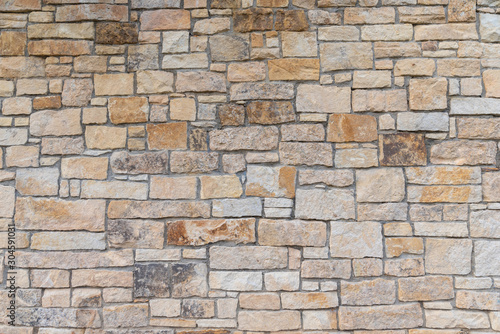 Ancient red stone wall flat background closeup