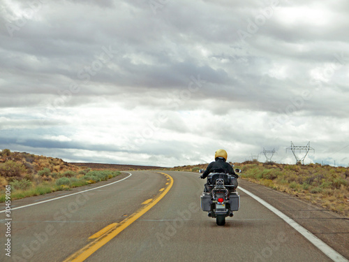 Motorcycle rider on empty Arizona road
