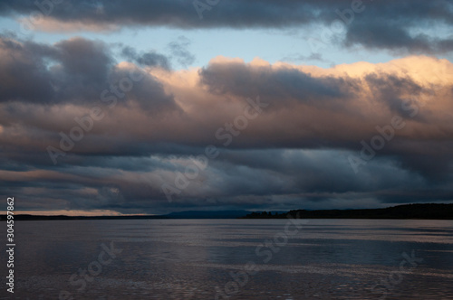 The sky before the rain with the landscape of the lower reaches of the Amur River.