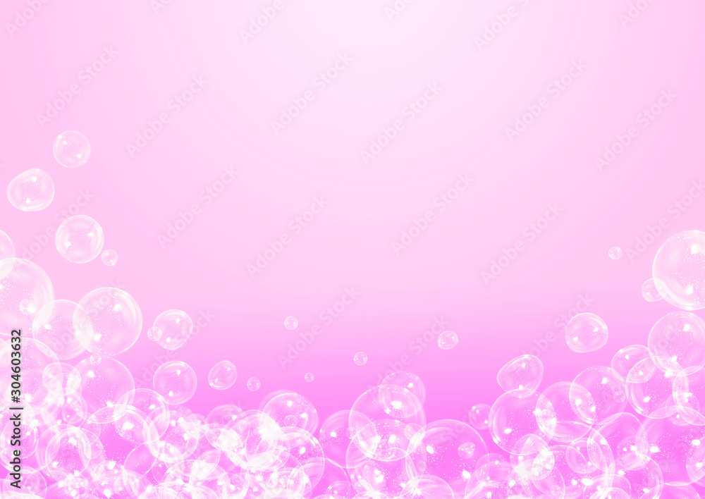 Soap bubbles on pink background with copy space