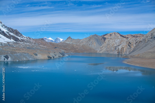 Tilicho Lake in Annapurna Conservation Area, Nepal, blue lake on mountain against sky