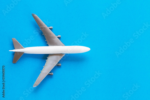 Travel concept using a plane on a blue background.