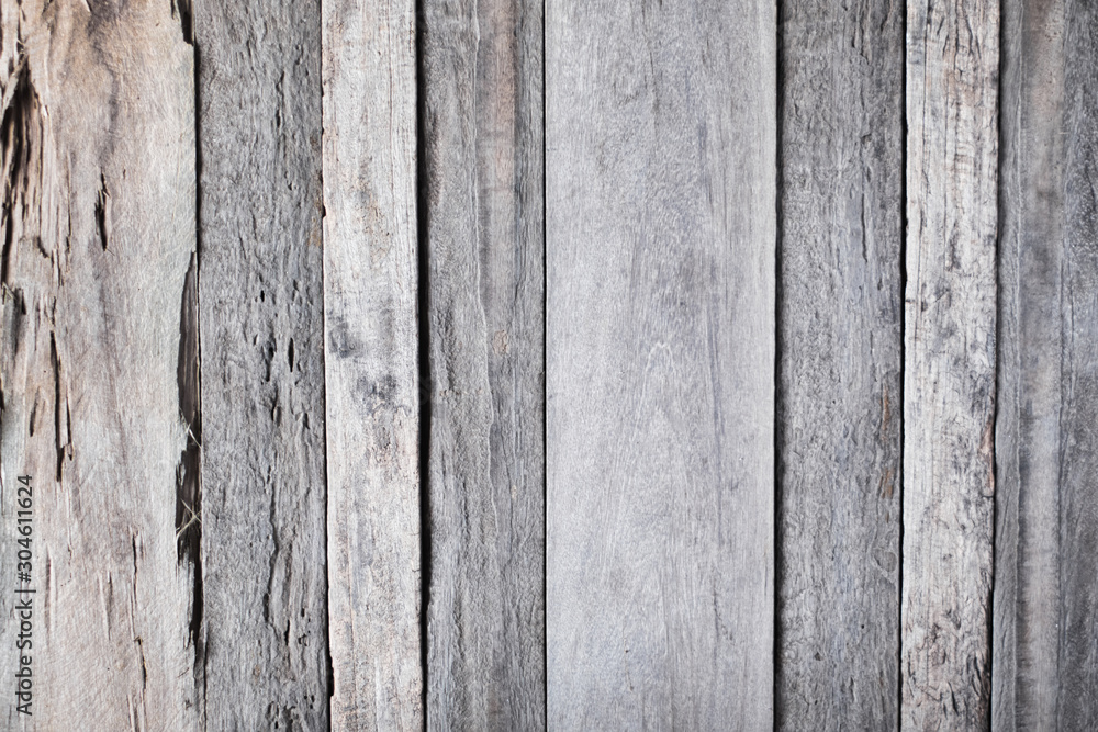 Naklejka premium Old and rustic grey barn wooden background or wall, detailed background photo texture.