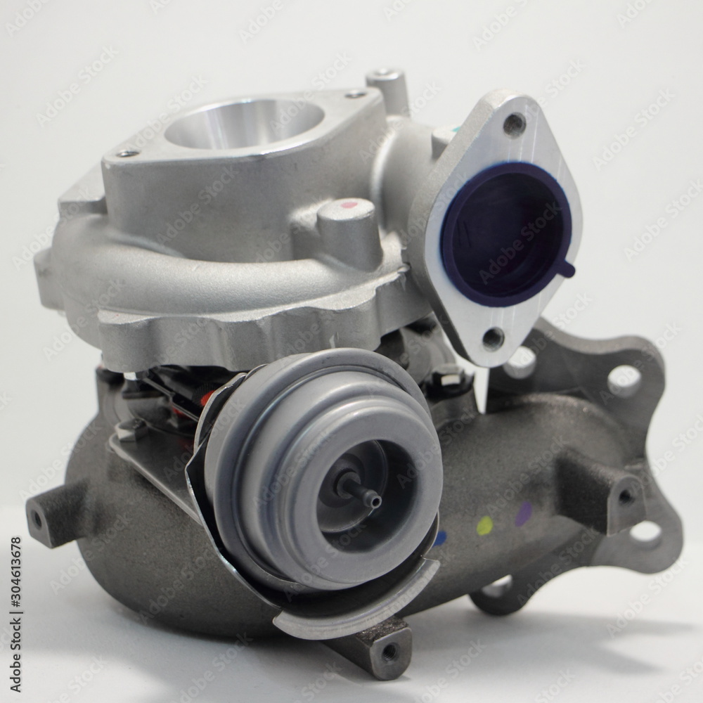 Naklejka premium New car turbine with blow off valve, motor turbo set close up on white background