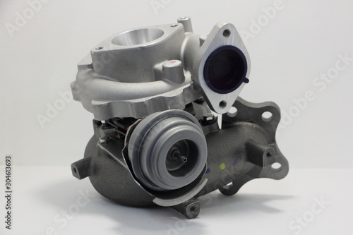 Obraz na płótnie New car turbo kit, motor turbine set with blow off valve close up on white background w salonie