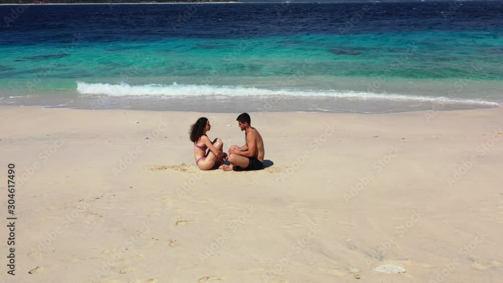 Perfect honeymoon vacation, summer romance concept, a couple on the tropical sandy beach Seychelles Perfect honeymoon vacation, summer romance concept, a couple on the tropical sandy beach Seychelles