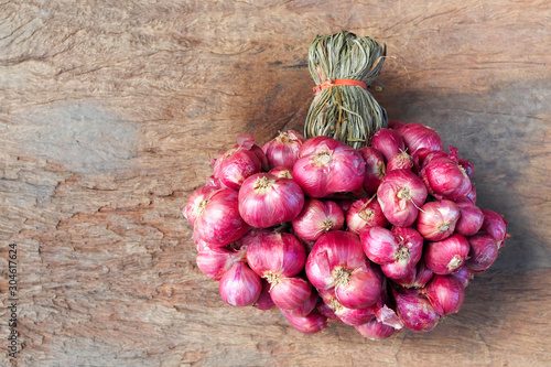 Shallot onions on old wooden background