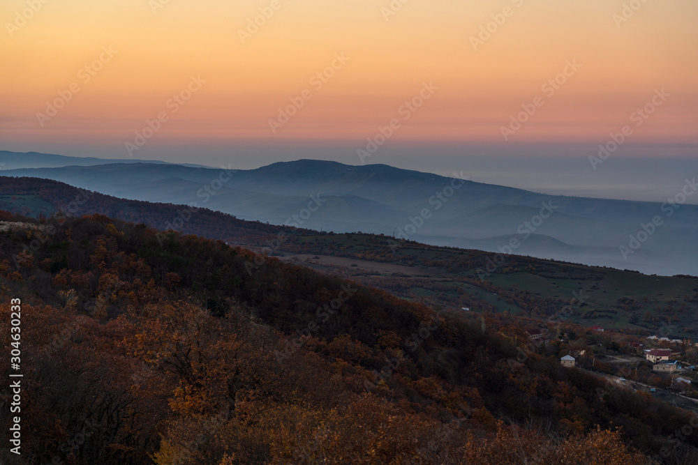 View of the mountain range and the village in evening time