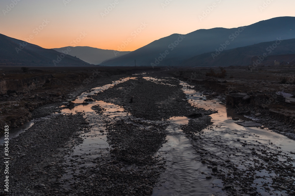 Mountain river bed at dusk