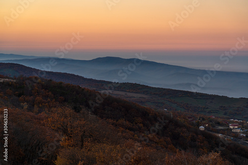 View of the mountain range and the village in evening time