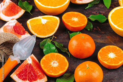 Sliced citrus fuits juicy  on table close up