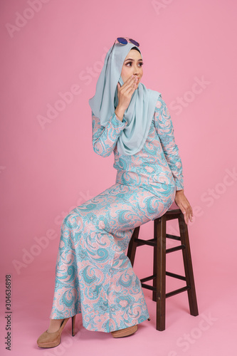 Beautiful Female Model Wearing Batik Design Baju Kurung With Hijab A Modern Lifestyle Outfit For Muslim Woman Isolated Over Pink Background Eidul Fitri Fashion And Beauty Concept Stock Photo Adobe Stock