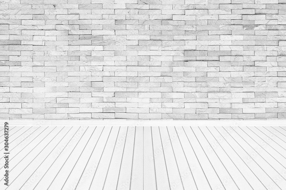 bright empty room with brick wall and wooden floor bright empty room with brick wall and wooden floor