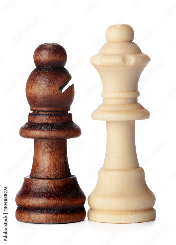 White and brown wooden chess pieces on white background White and brown wooden chess pieces on white background