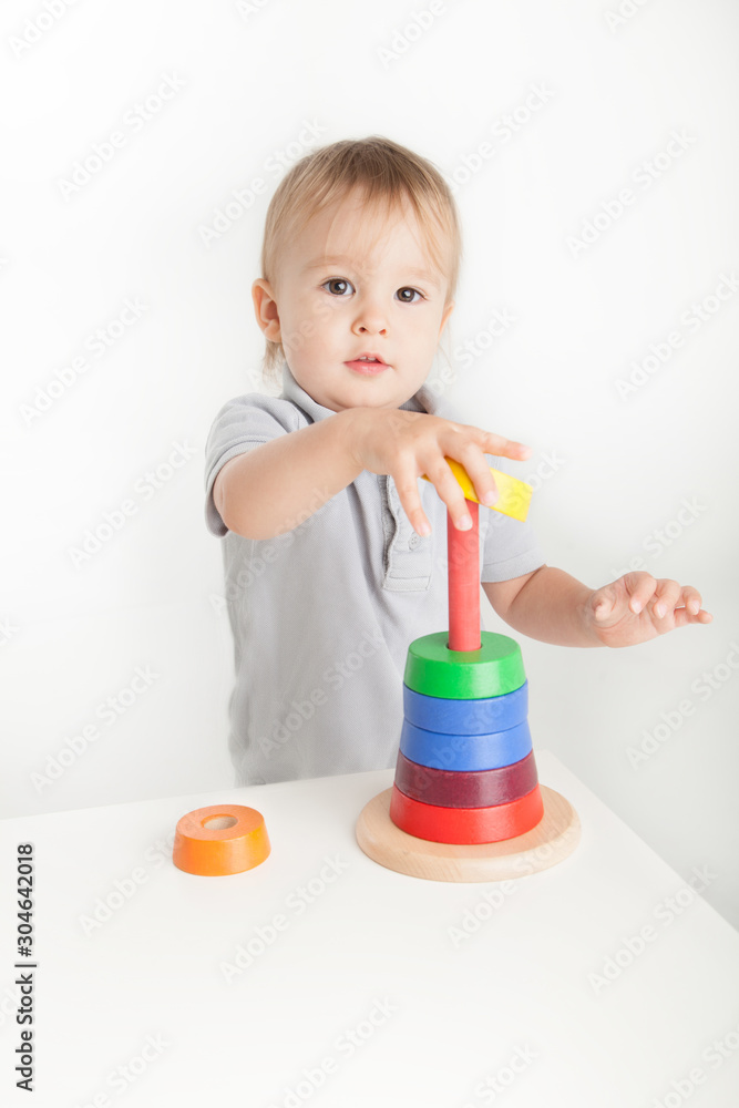 Child playing with wood stacking toy Child playing with wood stacking toy