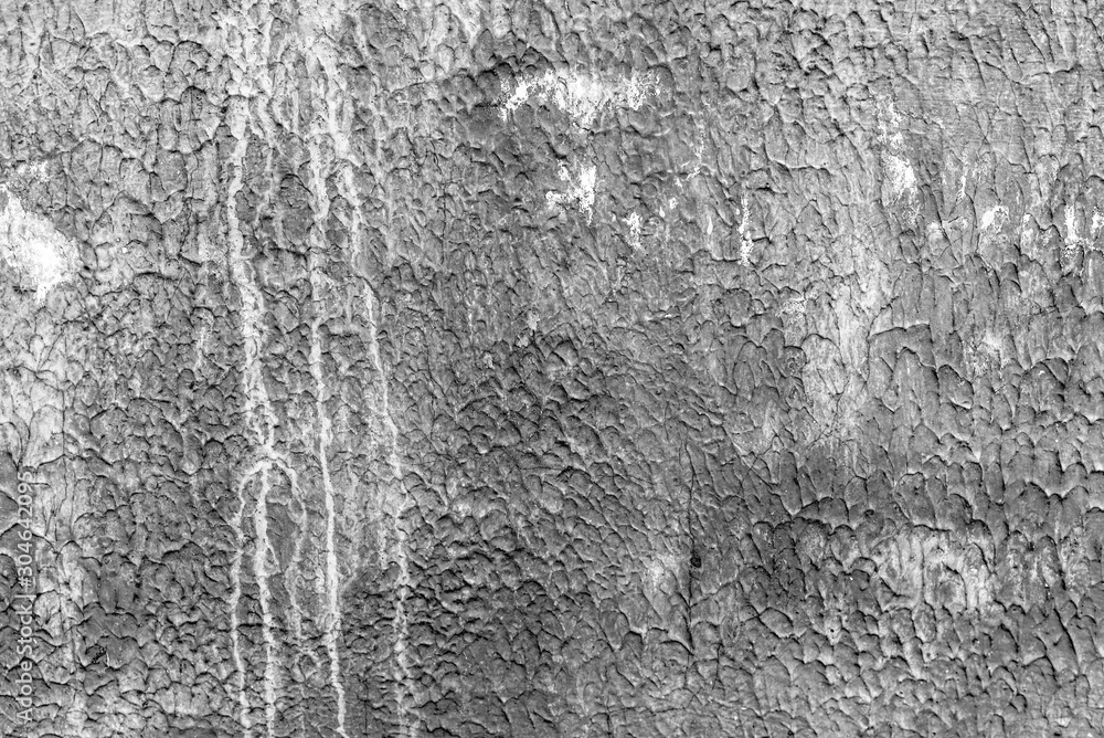 Texture of a concrete wall with cracks and scratches which can be used as a background Texture of a concrete wall with cracks and scratches which can be used as a background