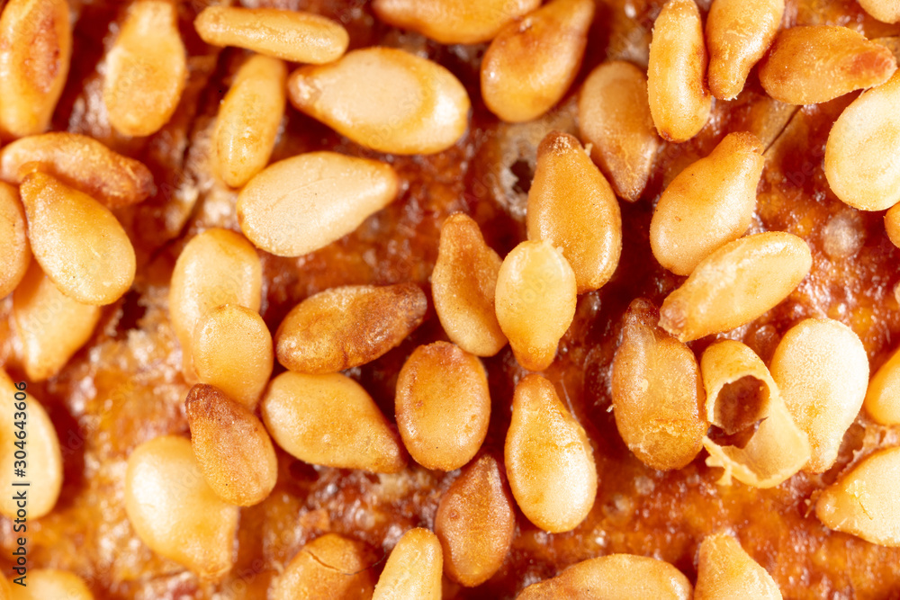 Sesame seeds on a brown crust of bread Sesame seeds on a brown crust of bread