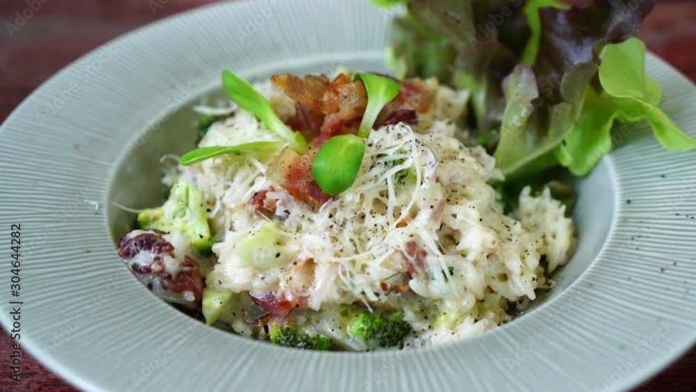 risotto rice with bacon on plate risotto rice with bacon on plate