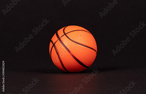 Single small rubber toy in form of basketball © michaklootwijk