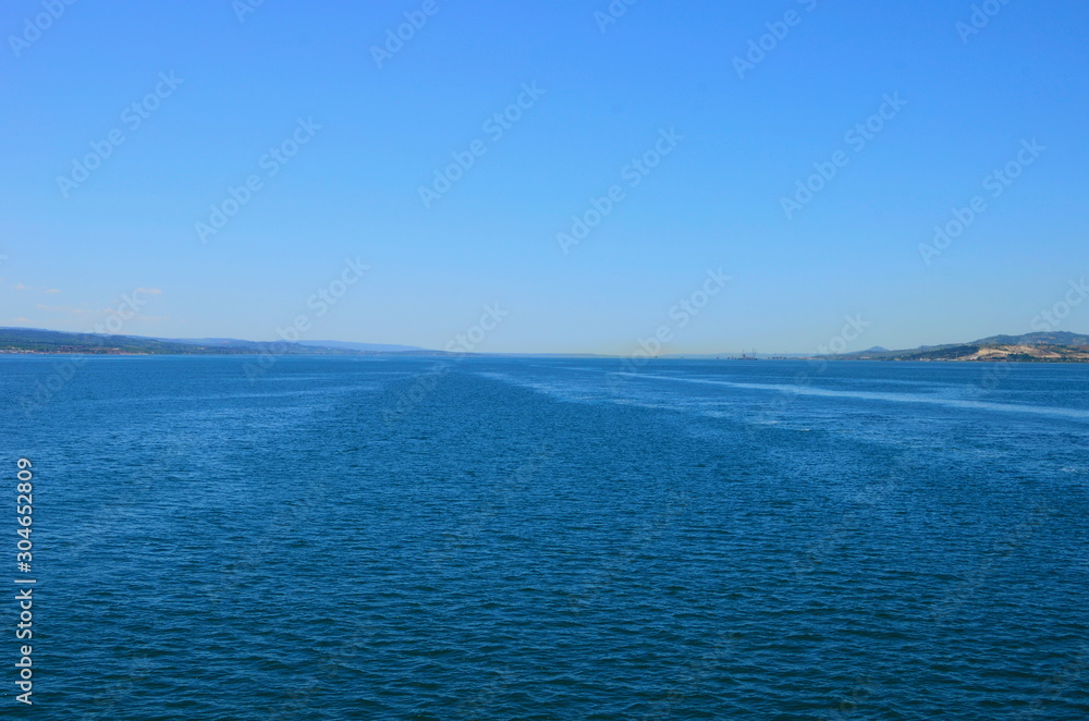 The bank of Dardanelles (Canakkale strait) view from sea in summer morning time The bank of Dardanelles (Canakkale strait) view from sea in summer morning time